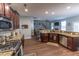 Well appointed kitchen featuring stainless appliances, granite countertops, and hardwood floors at 7217 Mossy Creek Ln, Hanahan, SC 29410