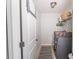 A conveniently located laundry room has tile floor and full-size appliances at 7217 Mossy Creek Ln, Hanahan, SC 29410