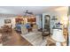 Open-concept living room leading to a modern kitchen with stainless steel appliances and a breakfast bar at 7217 Mossy Creek Ln, Hanahan, SC 29410