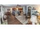 Open-concept living room leading to a modern kitchen with stainless steel appliances and a breakfast bar at 7217 Mossy Creek Ln, Hanahan, SC 29410