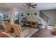 A spacious living room with lots of seating and access to other rooms at 7217 Mossy Creek Ln, Hanahan, SC 29410