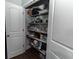 View of the storage in the pantry with white door and wire shelving at 7217 Mossy Creek Ln, Hanahan, SC 29410