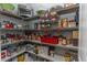 Organized walk-in pantry with wire shelving stocked with food items and small appliances at 7217 Mossy Creek Ln, Hanahan, SC 29410