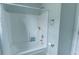 Clean white shower and tub with shower curtain and brushed nickel fixtures at 7217 Mossy Creek Ln, Hanahan, SC 29410