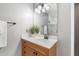 Well-lit bathroom vanity with a white counter and a shower reflected in the mirror at 9309 Sweetbay Ct, Ladson, SC 29456