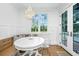 Charming breakfast nook with a round white table, banquette seating, and bright lighting at 1075 Avenue Of Oaks, Charleston, SC 29407