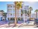 The Palms Oceanfront Hotel three-story exterior view on a sunny day at 1126 Ocean Blvd # 109, Isle of Palms, SC 29451