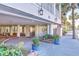 Hotel parking entrance with tropical landscaping and access to elevators at 1126 Ocean Blvd # 116, Isle of Palms, SC 29451