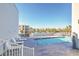 Stunning pool area with inviting lounge chairs, perfect for relaxation and enjoying the outdoors at 1126 Ocean Blvd # 203, Isle of Palms, SC 29451