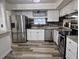 Modern kitchen with stainless steel appliances, granite countertops, and ample cabinet space for storage at 113 Ford Ct, Summerville, SC 29483