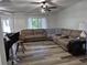 Spacious living room with neutral tones and a large sectional sofa, ideal for relaxing and entertaining guests at 113 Ford Ct, Summerville, SC 29483