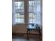 Bright window in the living room provides natural light, complemented by sheer curtains and a decorative glass table at 113 Ford Ct, Summerville, SC 29483