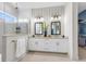 Elegant bathroom with double vanities, modern fixtures, and a glass-enclosed shower at 1168 Reserve Ln, Awendaw, SC 29429