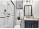 Elegant bathroom with a glass-enclosed shower, granite countertop, and modern fixtures and finishes at 1168 Reserve Ln, Awendaw, SC 29429