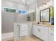 Bright bathroom featuring double vanities, a glass-enclosed shower, and stylish fixtures at 1168 Reserve Ln, Awendaw, SC 29429
