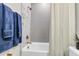 Modern bathroom featuring a tub, shower, stylish tile, and gold fixtures at 1168 Reserve Ln, Awendaw, SC 29429