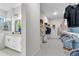 Walk-in closet with custom shelving and storage, adjacent to the bathroom at 1168 Reserve Ln, Awendaw, SC 29429