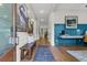 Bright foyer featuring beautiful wood floors, stylish decor, bench seating, and views to the main living areas at 1168 Reserve Ln, Awendaw, SC 29429