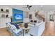 Stylish living room featuring a blue accent wall, comfortable seating, and a view of the staircase at 1168 Reserve Ln, Awendaw, SC 29429
