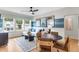 Bright and airy living room with a large window, modern decor, and comfortable seating at 1168 Reserve Ln, Awendaw, SC 29429