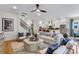 Elegant living room with a staircase, open kitchen, and comfortable seating at 1168 Reserve Ln, Awendaw, SC 29429