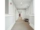 Hallway with neutral carpet and decor, highlighted by bright overhead lighting and a bench for seating at 118 Cooper River Dr, Mount Pleasant, SC 29464