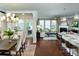 Bright open-concept living room with hardwood floors, a fireplace and a dining area at 1195 Reserve Ln, Awendaw, SC 29429