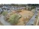 Aerial view of a neighborhood with a well-maintained common area, gazebo, and colorful homes at 129 Sabal Ct, Summerville, SC 29483