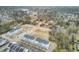 High aerial view of a new construction community with trees, parking, common areas, and nearby homes at 129 Sabal Ct, Summerville, SC 29483