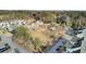 Aerial view of a community with landscaped common areas, mature trees, and pond views at 129 Sabal Ct, Summerville, SC 29483
