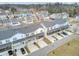 A neighborhood of townhomes with grey roofs, light siding, balconies, and screened porches is shown at 129 Sabal Ct, Summerville, SC 29483