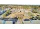 An aerial view displays single Gathering homes overlooking a central green space with landscaping and park structures at 129 Sabal Ct, Summerville, SC 29483