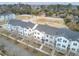 Beautiful aerial view of townhomes with large balconies and patios in a neighborhood surrounded by trees at 129 Sabal Ct, Summerville, SC 29483