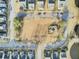 Aerial view of a community showing the layout of homes, streets, and common area with gazebo at 129 Sabal Ct, Summerville, SC 29483
