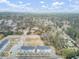 High aerial view of a new construction community showing tree coverage, parking, and common areas at 129 Sabal Ct, Summerville, SC 29483