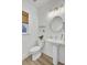 Simple bathroom with a pedestal sink, toilet, and decor, offering a clean and functional space at 129 Sabal Ct, Summerville, SC 29483