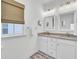 Bright bathroom with double vanity, modern mirrors and lighting at 129 Sabal Ct, Summerville, SC 29483