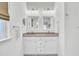 Bright bathroom with double vanity, modern mirrors and lighting at 129 Sabal Ct, Summerville, SC 29483