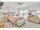 Bright bedroom with large window, neutral carpet and a bed with luxury decor and linens at 129 Sabal Ct, Summerville, SC 29483