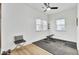 This exercise room features two windows for plenty of light and exercise equipment at 129 Sabal Ct, Summerville, SC 29483