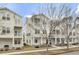 Inviting townhouse exterior featuring a cozy front porch with seating and neat landscaping at 129 Sabal Ct, Summerville, SC 29483
