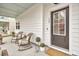 Cozy front porch featuring rocking chairs and view of home's entrance at 129 Sabal Ct, Summerville, SC 29483