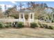 Charming gazebo with brick steps, perfect for outdoor gatherings, nestled within a beautifully landscaped community at 129 Sabal Ct, Summerville, SC 29483