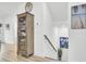 Bright hallway featuring a cabinet, stairway, neutral walls, and stylish decor in a modern home at 129 Sabal Ct, Summerville, SC 29483