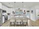 Modern kitchen with white cabinets, stainless steel appliances, and a spacious island at 129 Sabal Ct, Summerville, SC 29483