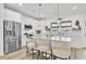 Bright kitchen featuring white cabinets, stainless appliances, and an island with seating at 129 Sabal Ct, Summerville, SC 29483