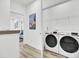 Laundry room featuring side-by-side washer and dryer, open to a living area at 129 Sabal Ct, Summerville, SC 29483