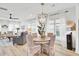Bright, open-concept living and dining area with hardwood floors and stylish furnishings at 129 Sabal Ct, Summerville, SC 29483