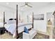 Bright main bedroom with a four-poster bed, neutral accents, and light wood flooring at 129 Sabal Ct, Summerville, SC 29483