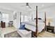 Bright main bedroom with a four-poster bed and neutral accents at 129 Sabal Ct, Summerville, SC 29483